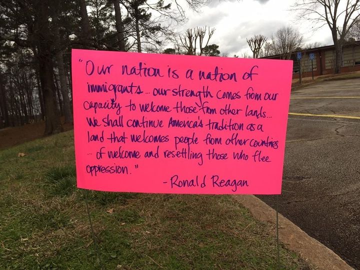 One of the handmade signs quotes President Ronald Reagan.