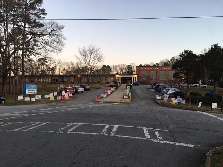 The signs that are currently in front of the school.