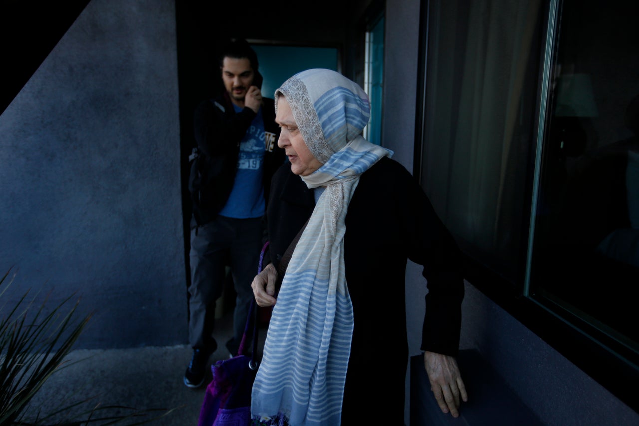 Marzieh Moosavizadeh and her grandson leave their hotel room in El Segundo after she was detained at LAX Jan. 29, 2017 in Los Angeles, California.