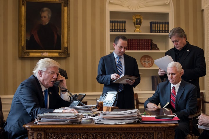 President Donald Trump speaks on the phone with Russian President Vladimir Putin in the Oval Office of the White House, Jan. 28, 2017