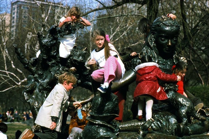 Kids play on the Alice in Wonderland statue in Central Park circa 1960.