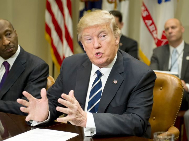 President Donald Trump attends a meeting in the Roosevelt Room of the White House on Jan. 31. A new HuffPost/YouGov survey finds Americans increasingly expect him to literally carry out his campaign pledges.