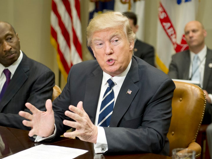 President Donald Trump attends a meeting in the Roosevelt Room of the White House on Jan. 31. A new HuffPost/YouGov survey finds Americans increasingly expect him to literally carry out his campaign pledges.