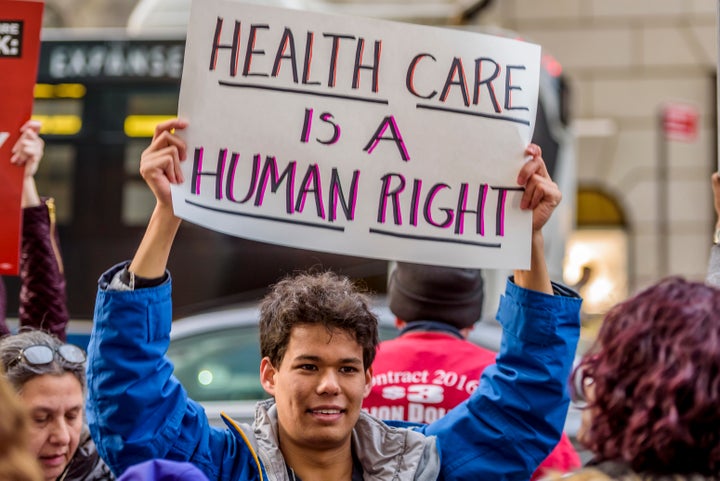 Protesters gather outside Trump Tower on Jan. 13 to remind the president why Obamacare matters.