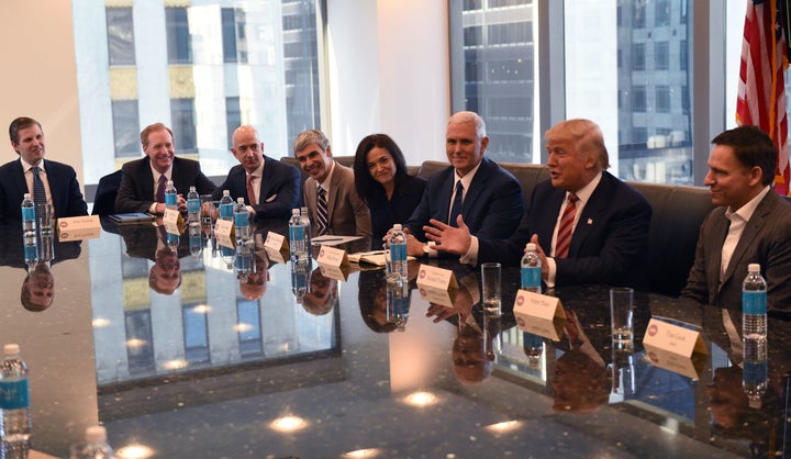 (L-R) Eric Trump, Amazon's chief Jeff Bezos, Larry Page of Alphabet, Facebook COO Sheryl Sandberg, Pence, Trump and Peter Thiel, co-founder and former CEO of PayPal, meet at Trump Tower Dec. 14, 2016 in New York.