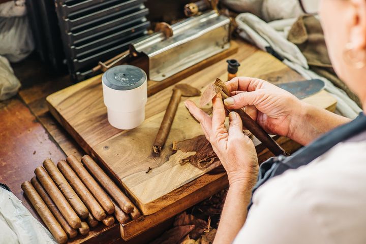 CIGAR MAKERS HAND ROLLING EACH CIGAR IN FRONT OF YOU IN YBOR CITY