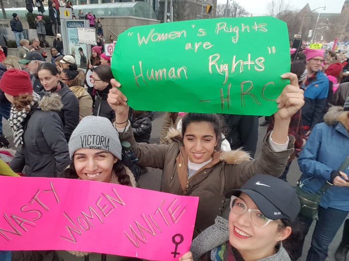 Tamana Riviere, right, with her sisters at the Women's March in Toronto.