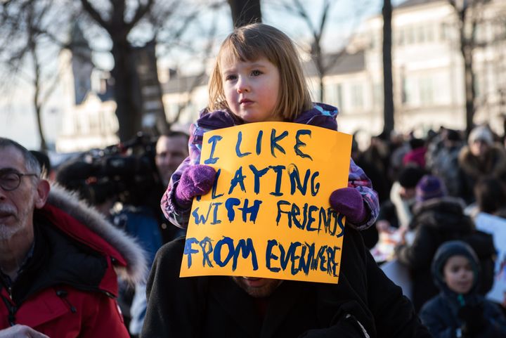 In New York, a young protester rallies against Donald Trump's executive order on immigration.