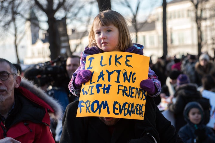 In New York, a young protester rallies against Donald Trump's executive order on immigration.