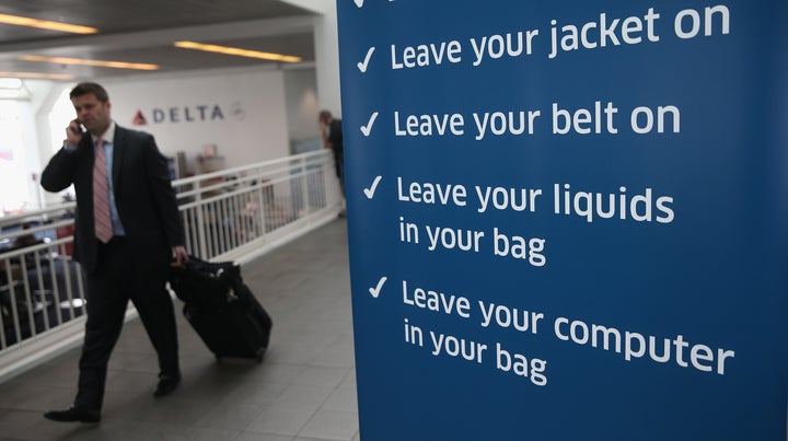 A sign welcomes travelers to the PreCheck lane at LaGuardia Airport.