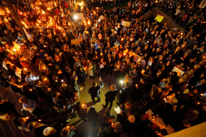 Volunteer lawyers defending refugees at Dallas/Fort Worth International Airport speak at a vigil for refugees on Jan. 30 in Dallas, one of the cities the Trump Organization is looking at as a location for a new luxury hotel.