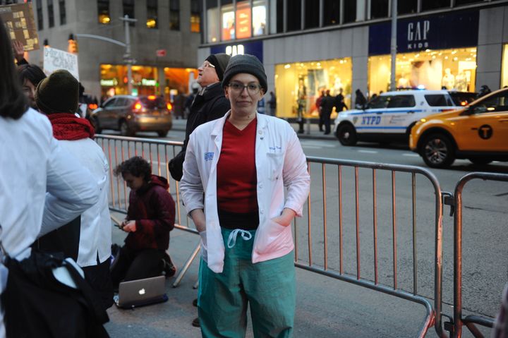 Medical student Mollie Nisen protests the possible repeal of the Affordable Care Act on Jan. 30, 2017 in New York City. Many demonstrators wore white coats.
