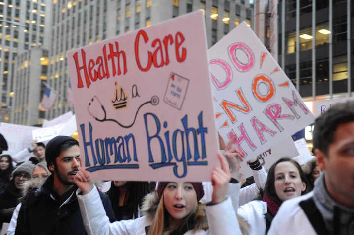 Demonstrators chanted, "No ban, no wall, health care for all" on Jan. 30, 2017 to show their opposition to Republicans' promise to repeal the Affordable Care Act and to other Trump administration policies.