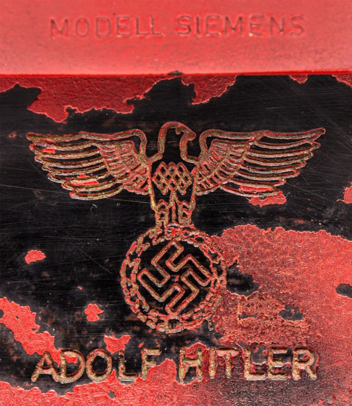 The Siemens phone also has a swastika and NSDAP eagle inscribed above Hitler’s name