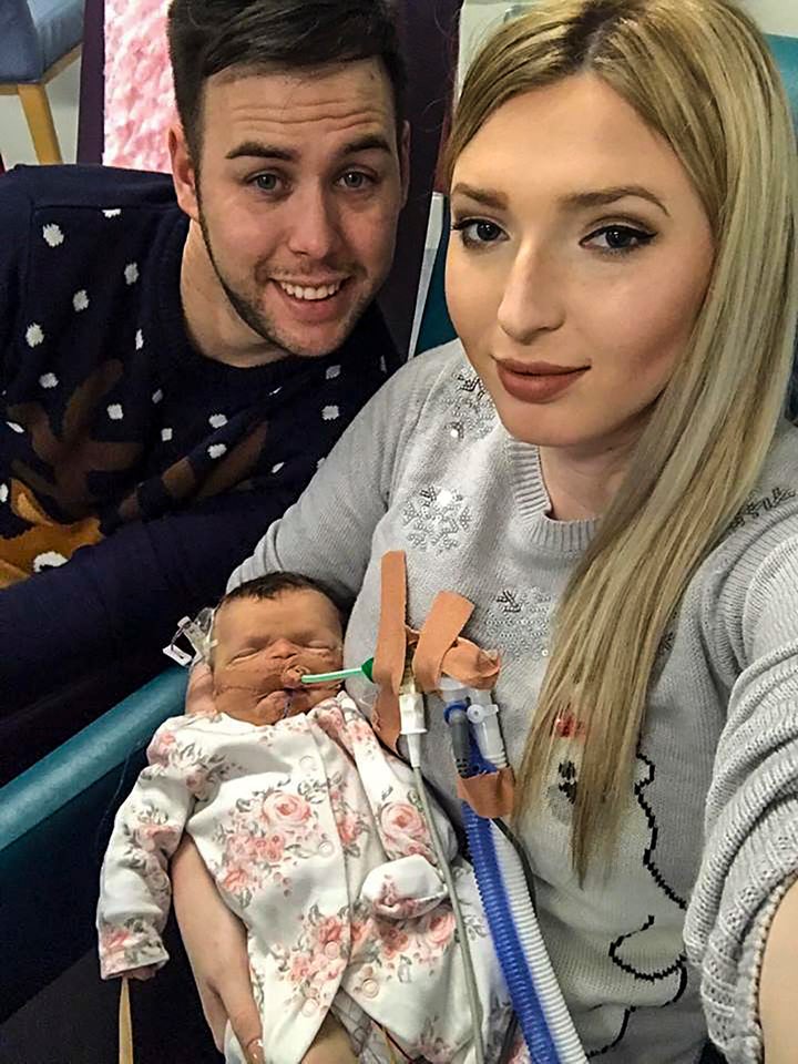 Charlotte Szakacs, 21, and her husband Attila Szakacs, 28, with their daughter Evlyn.