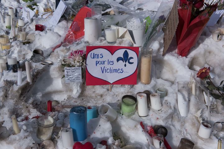 Tributes near a mosque where six people were shot dead on Monday in Quebec 
