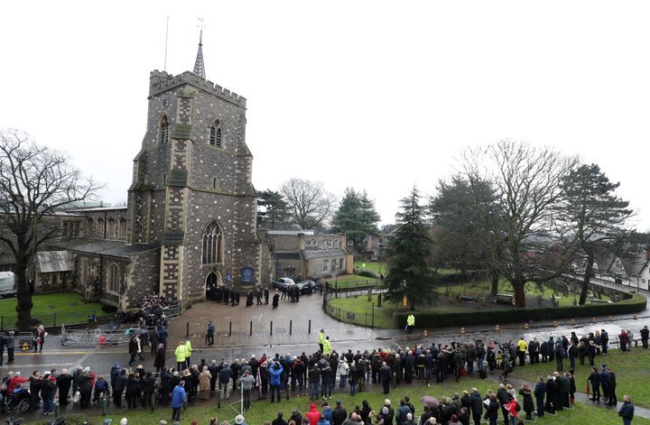 Crowds arrive for the funeral in Watford on Wednesday
