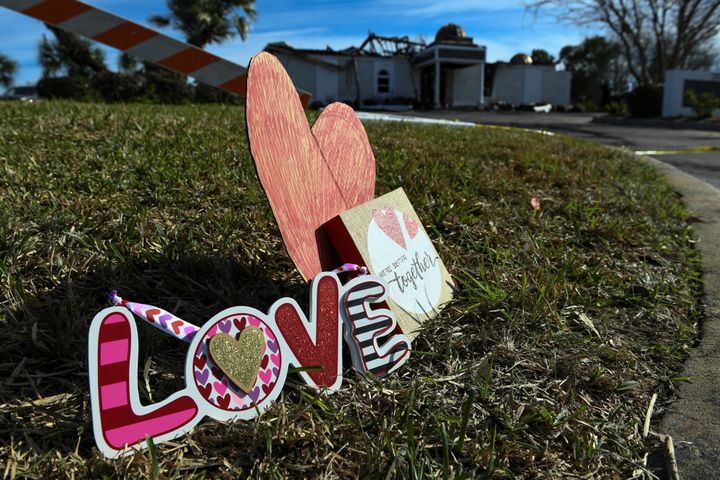 Signs rest outside the Victoria Islamic Center a day after the fire