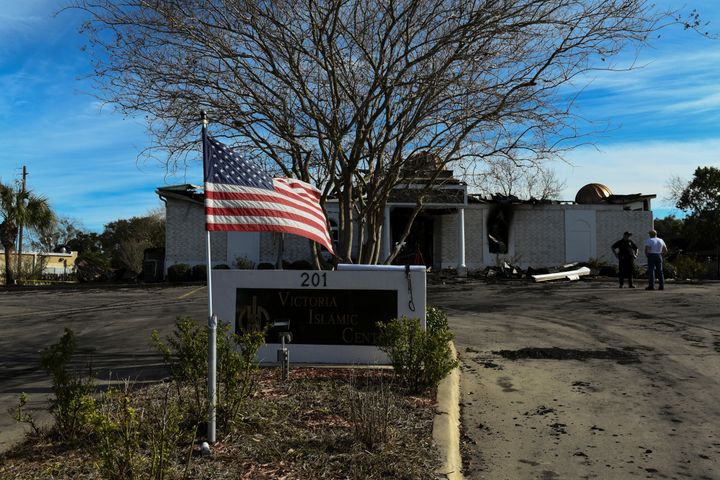 A US flag flies outside the center after the fire