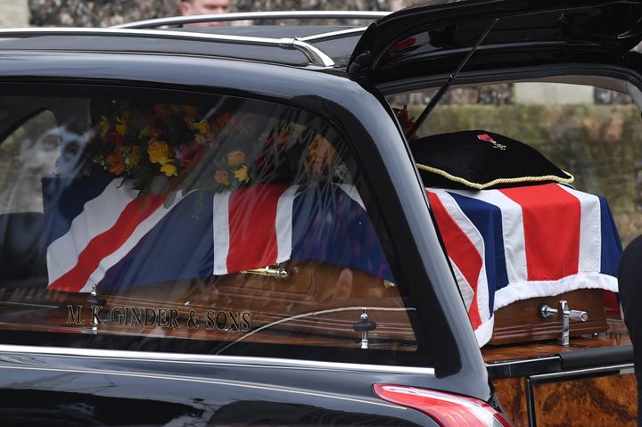 Taylor's coffin draped in a Union Jack flag