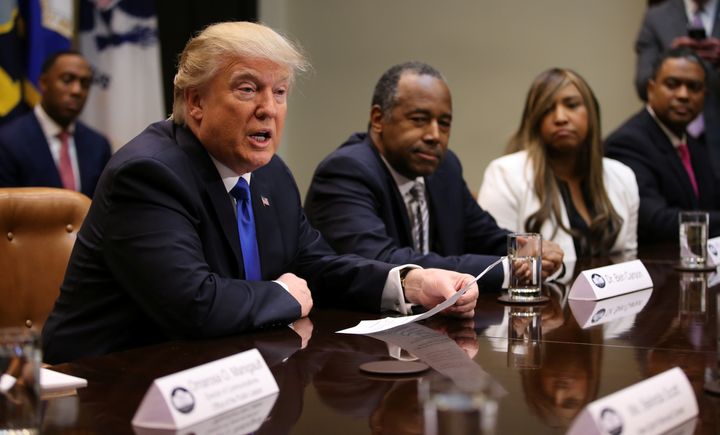 President Donald Trump and Dr. Ben Carson, nominated to be the next secretary of housing and urban development, attend a Black History Month listening session on Feb. 1 at the White House.