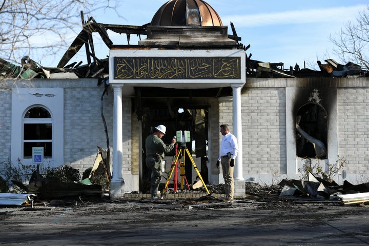 Security officials investigate the aftermath of a fire at the Victoria Islamic Center mosque in Victoria, Texas on Jan. 29, 2017.