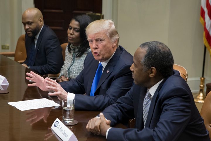 (L-R) Pastor James Davis of the National Diversity Coalition For Trump, Director of Communications for Office of the Public Liaison Omarosa Manigault, Trump and nominee to lead the Department of Housing and Urban Development Ben Carson