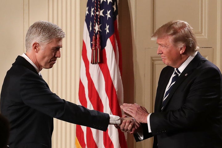 President Donald Trump shakes hands with Judge Neil Gorsuch after nominating him to the Supreme Court.