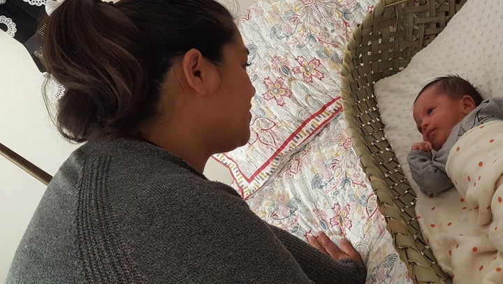 Summer Wharekawa watches her son, Tiaho Wharekawa-Campbell, in his wahakura, a modern version of a traditional woven baby basket used by New Zealand’s indigenous Māori populations in the 1600s.