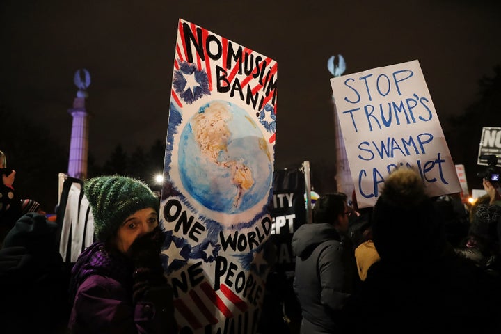 Hundreds of people attend a rally at Grand Army Plaza in Brooklyn before marching to Sen. Charles Schumer's Prospect Park West apartment on Jan. 31 in New York City.