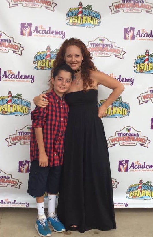 <p>Mindy and Oliver at Morgan’s Wonderland Wall of Fame. </p>