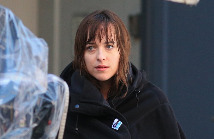 <em>Dakota Johnson as Anastasia Steele on the set of Fifty Shades of Grey</em>
