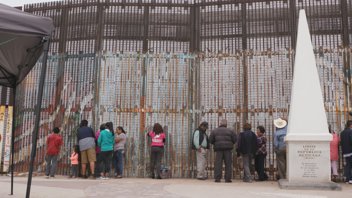 Beyond Borders Film- Mother visiting her child at the San Diego/Tijuana Wall.