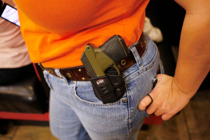 Morgan Meritt of Del City, Oklahoma, wears an unconcealed weapon at Beverly's Pancake House in Oklahoma City on Nov. 1, 2012.