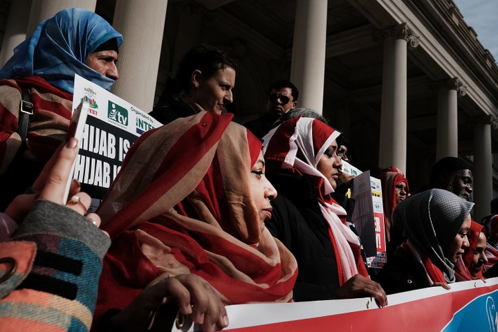 Women wear American flag hijabs at an event at City Hall for World Hijab Day on Wednesday in New York City.