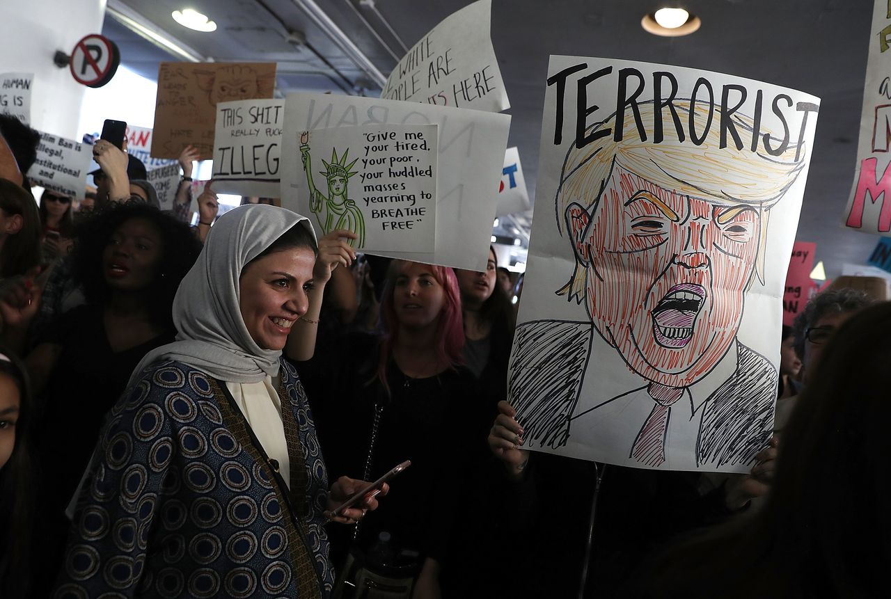 International travelers are welcomed by protesters holding signs during a demonstration against the immigration ban that was imposed by U.S. President Donald Trump at Los Angeles International Airport on Jan. 29, 2017