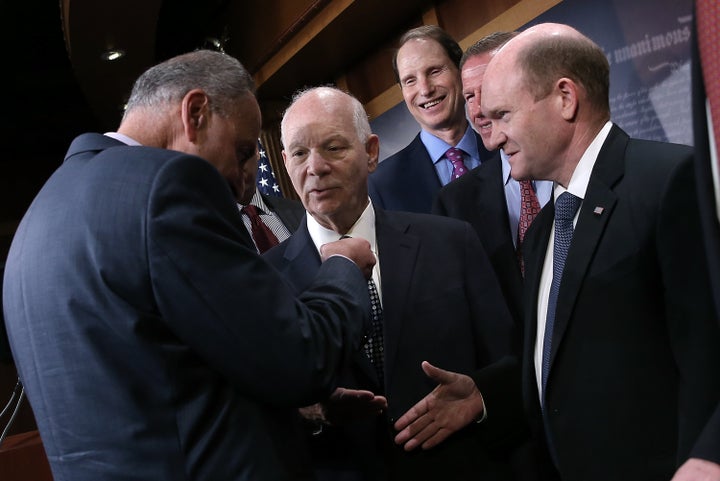 Sen. Chris Coons (D-Del.), pictured at right, warned that a battle over President Donald Trump's Supreme Court pick could fur