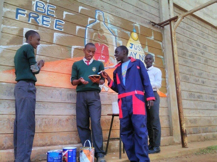 Anti-drug wall mural being painted by youth, HOPE Program, Kenya