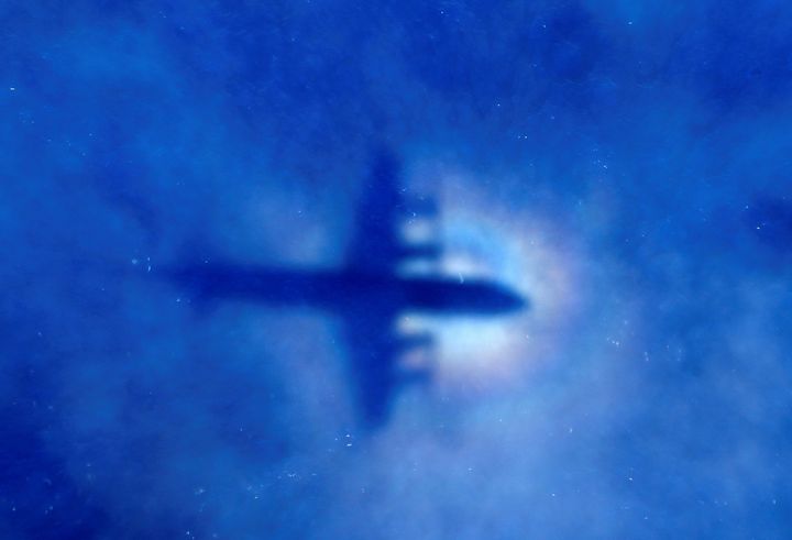 In this March 31, 2014 file photo, the shadow of a Royal New Zealand Air Force P3 Orion is seen on low level cloud while the aircraft searches for missing Malaysia Airlines Flight MH370 in the southern Indian Ocean, near the coast of Western Australia.