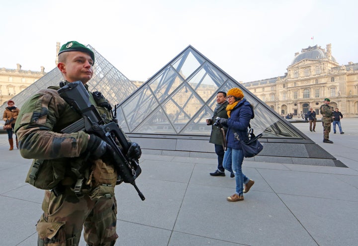 A French soldier wounded a man armed with a machete after he tried to enter the Louvre museum in Paris.