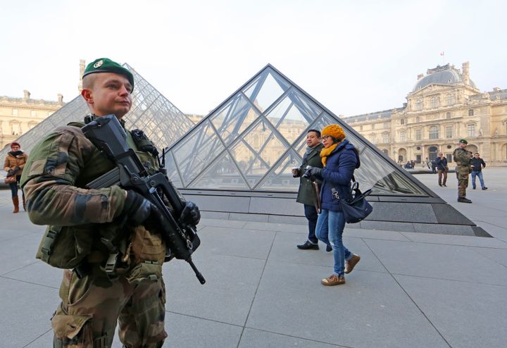 A French soldier wounded a man armed with a machete after he tried to enter the Louvre museum in Paris.
