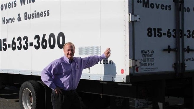 Mover Bob Christensen of Loves Park, Illinois, beside one of his trucks. People moving for jobs or a lower cost of living helped drive population losses in eight states, the highest number in almost 30 years.