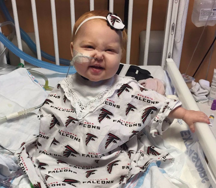 Ella's grandmother made her a special Atlanta Falcons-themed hospital gown.