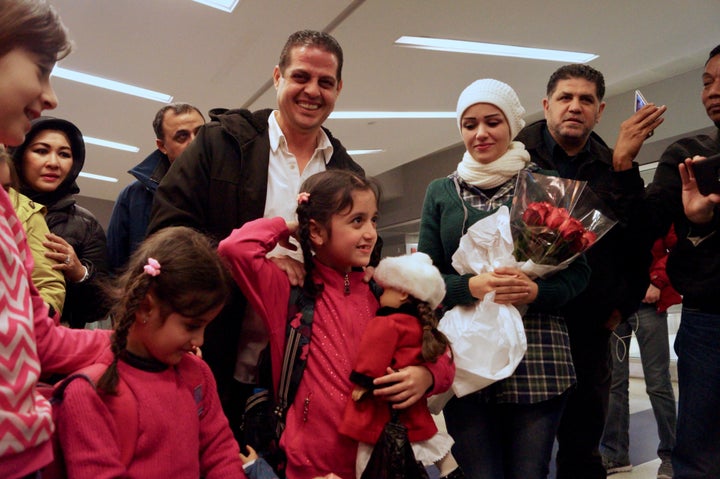 Fadi Kassar is all smiles after being reunited with his daughters Lian, 5, and Hnan, 8, and wife Razan for the first time in more than two years.