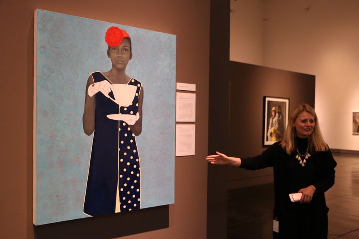 Dorothy Moss, director of the Outwin Boochever Portrait Competition, shows the first-place-winning “Miss Everything (Unsuppressed Deliverance) by Amy Sherald of Baltimore, Maryland.