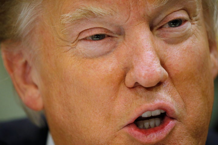 President Donald Trump's administration Friday announced narrow economic sanctions against 25 individuals and companies in re