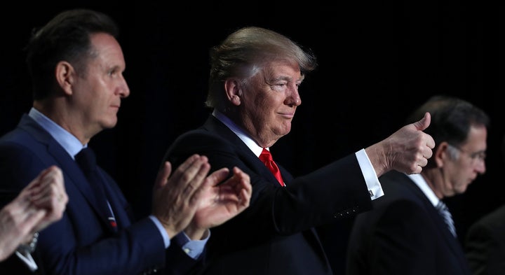President Donald Trump gives a thumbs up during introductions at the National Prayer Breakfast in Washington, D.C. on Thursda