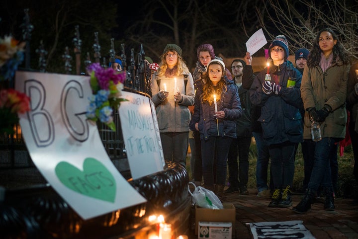 Community members hold candles at the Bowling Green Massacre Remembrance Gathering Feb. 3, 2017. Organizer Justin Swindle, 27, said it all began as a joke with friends. "It somehow got super popular, so we tried to make it matter by collecting donations," he said. Donations will be given to the International Center of Kentucky.