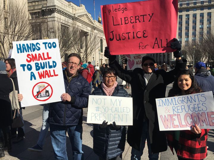 From left to right: Jon and Diana Sokolow, Tom Smith and Christina Dawson protest Trump's travel ban outside the White House on Saturday, Feb. 4, 2017.