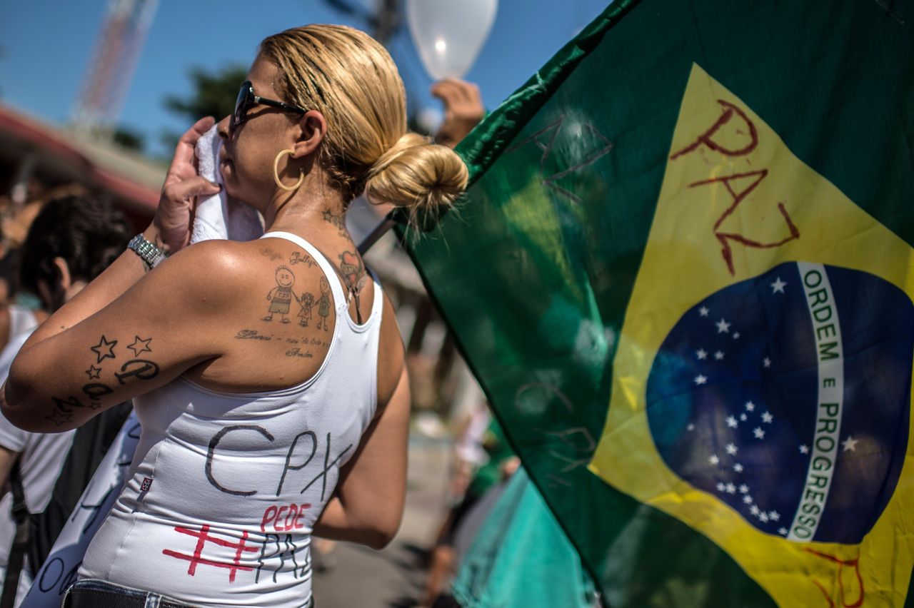 Protesters calling for peace and an end to police violence protest in Rio de Janeiro's Alemao favelas in 2015.